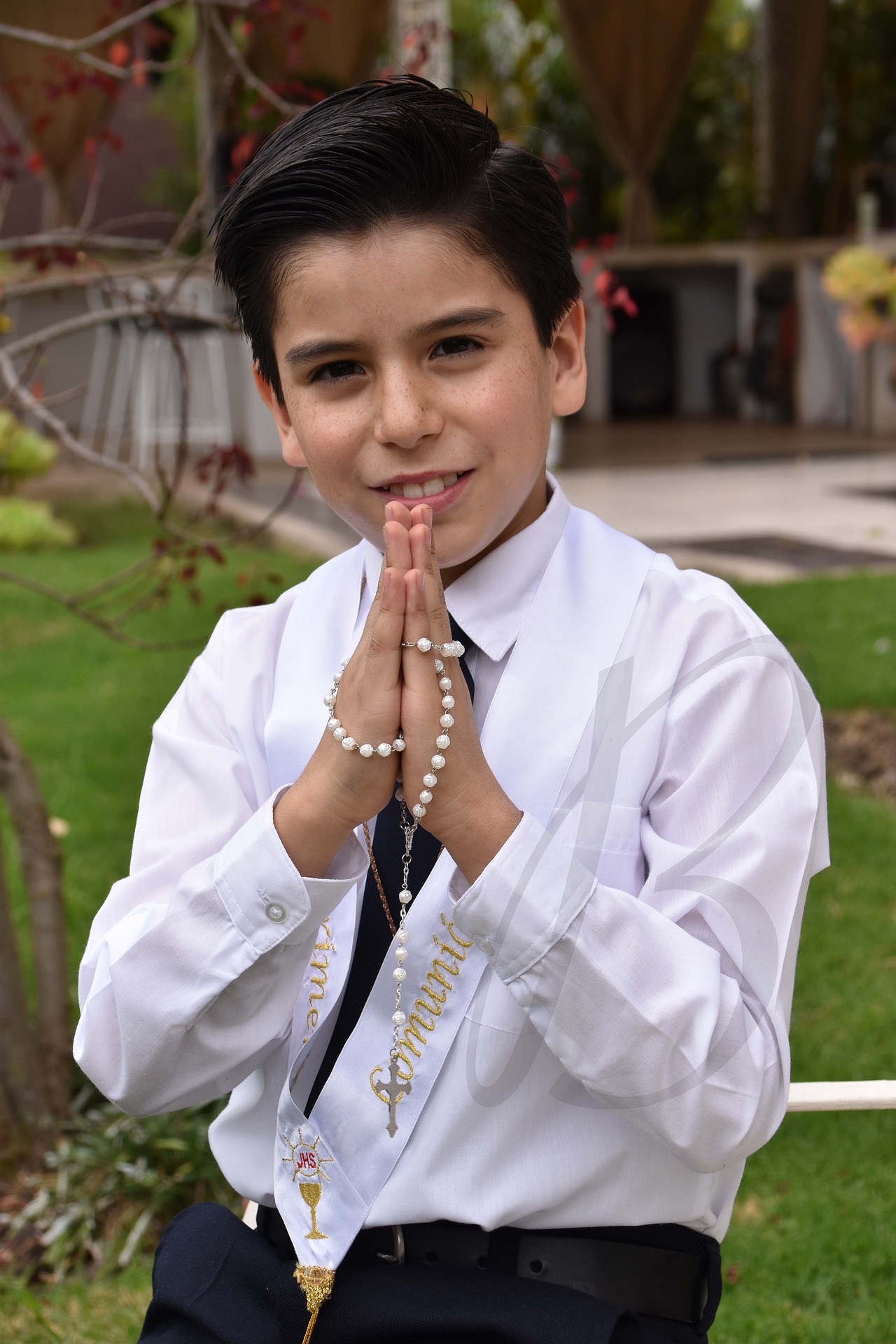 child praying communion pose