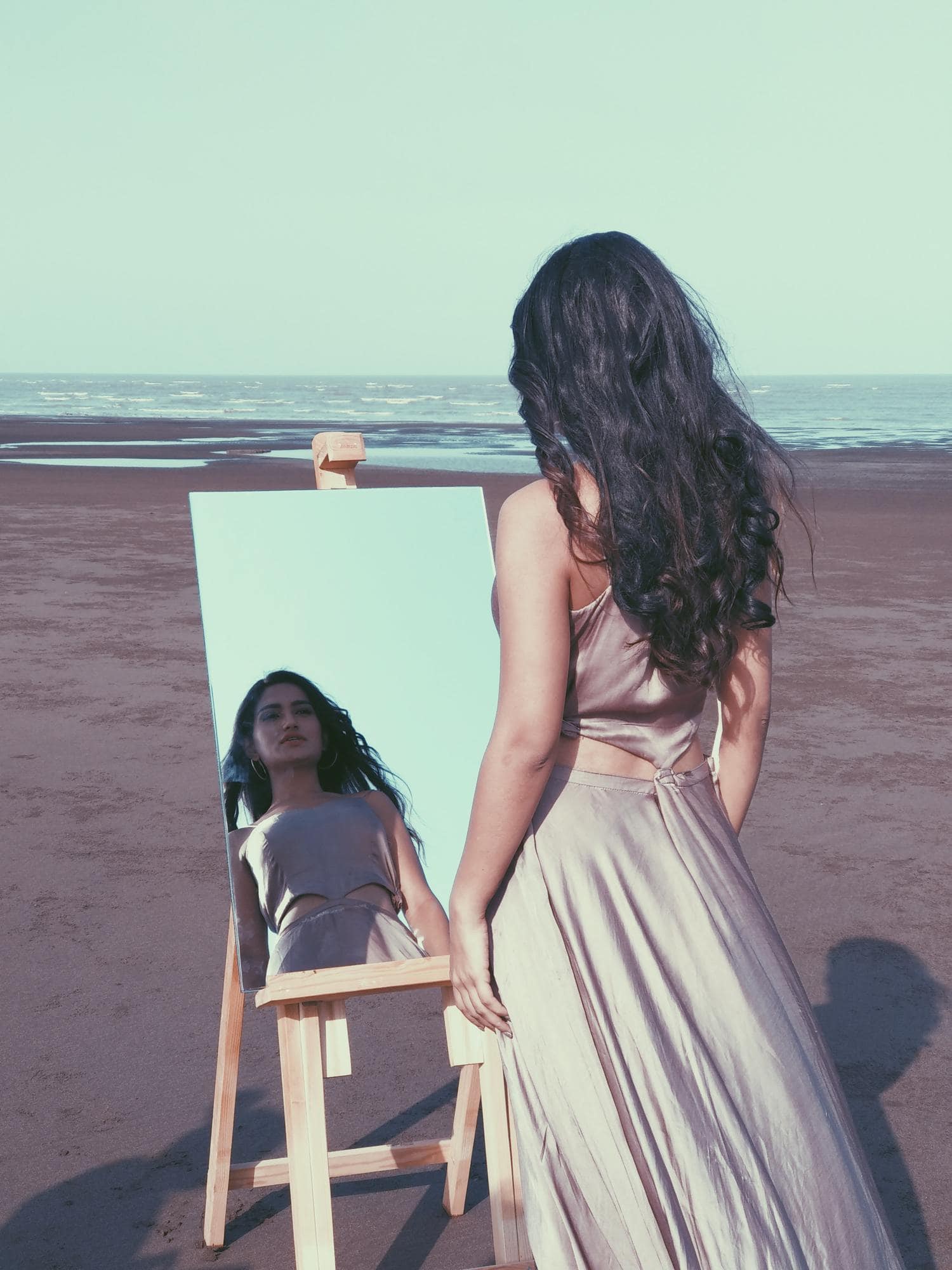 woman mirror beach