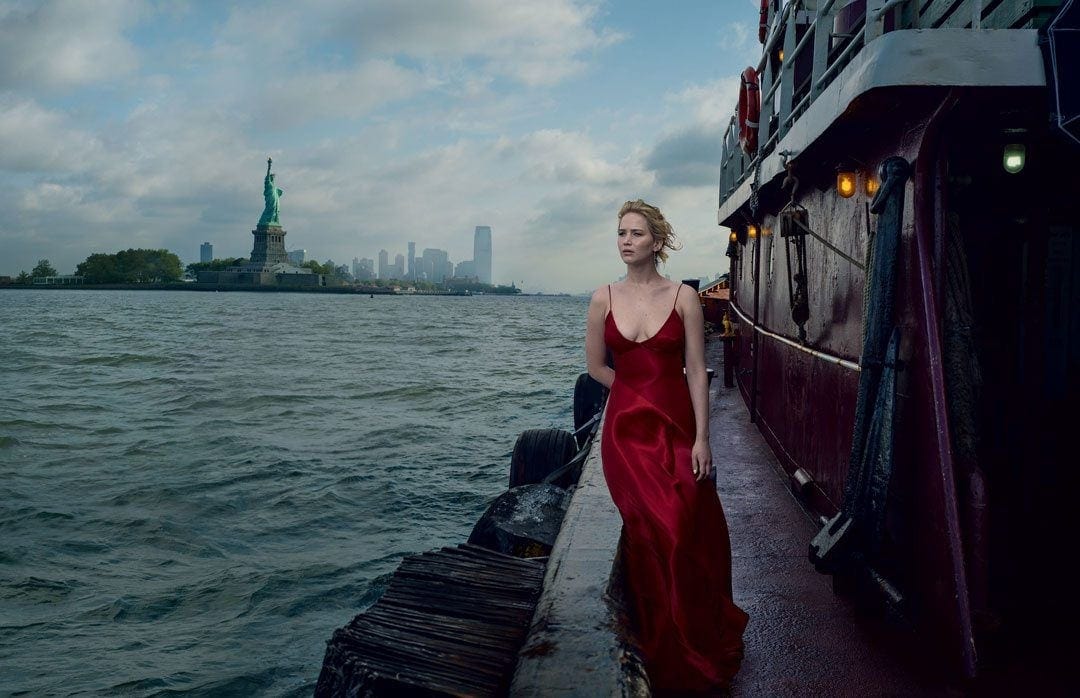 Portrait by Annie Leibovitz with Statue of Liberty in the background