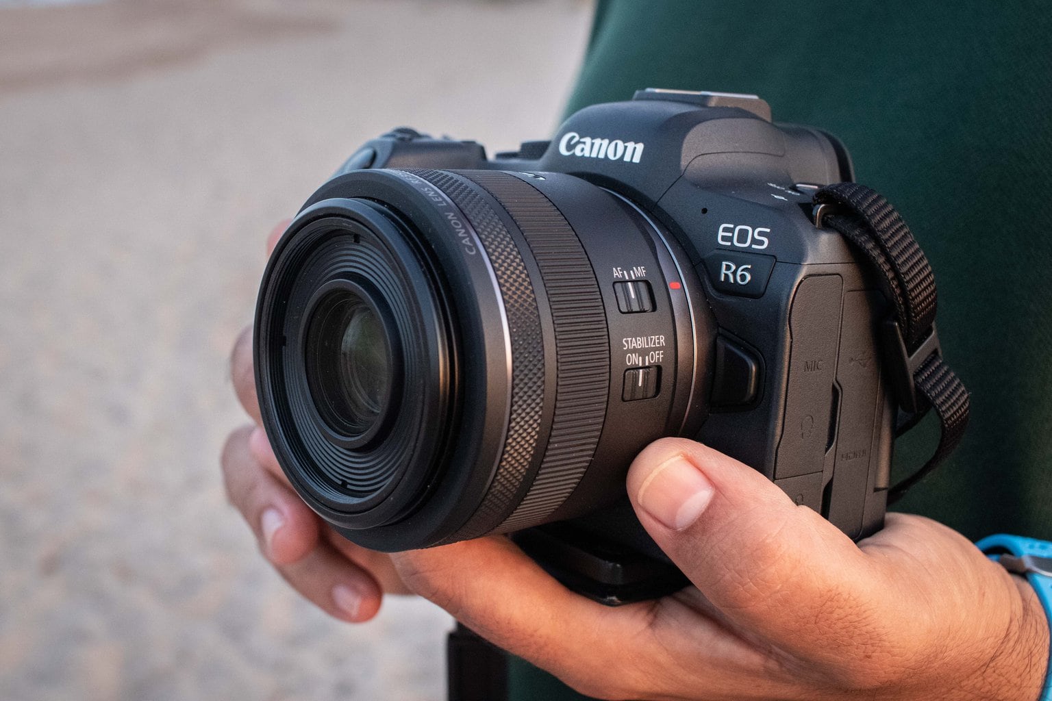 Photographer with canon eos R6 in hands